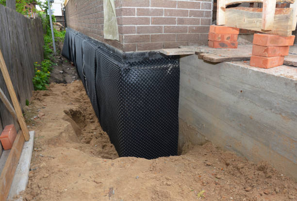 Happy homeowners after waterproofing job in Whitehall